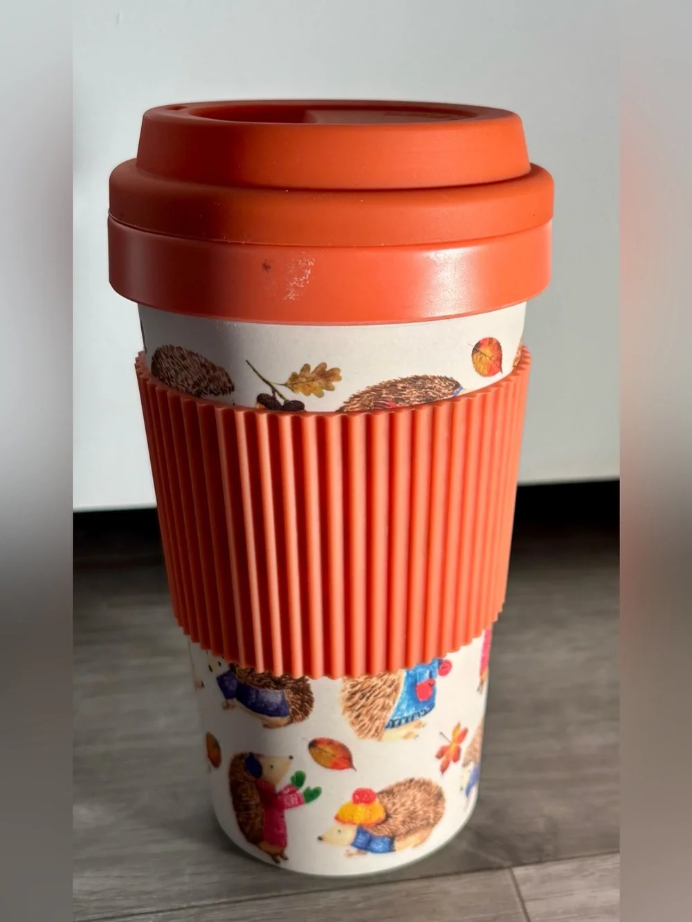Reusable Orange Travel Mug Tumbler with Ribbed Grip and Hedgehog Print